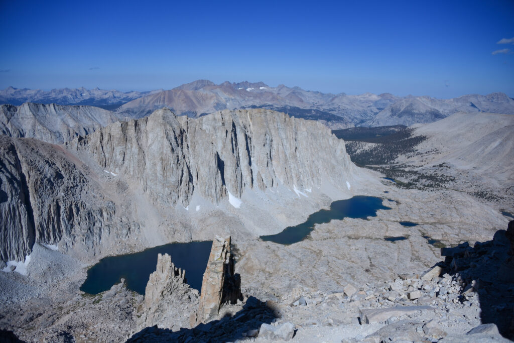 Looking down into a jagged valley with lake